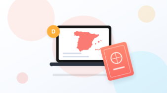Laptop showing a map of Spain next to a passport